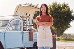Woman in front of a truck she can use as a business vehicle write off