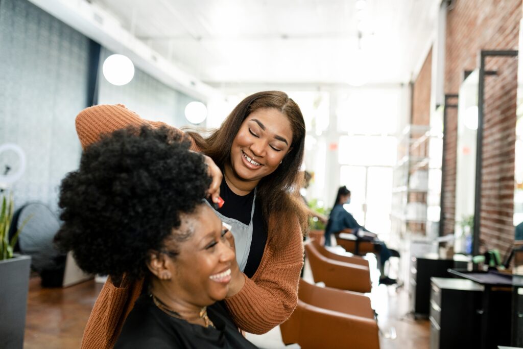 A woman who owns a salon celebrates black business month