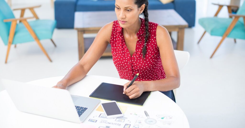 a small business owner at a computer doing ERP (enterprise resource planning)