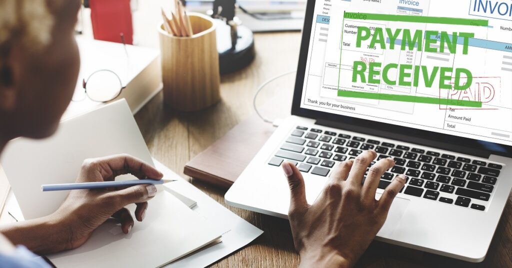 a small business owner wondering, "what is cash flow" and learning about it with an invoice