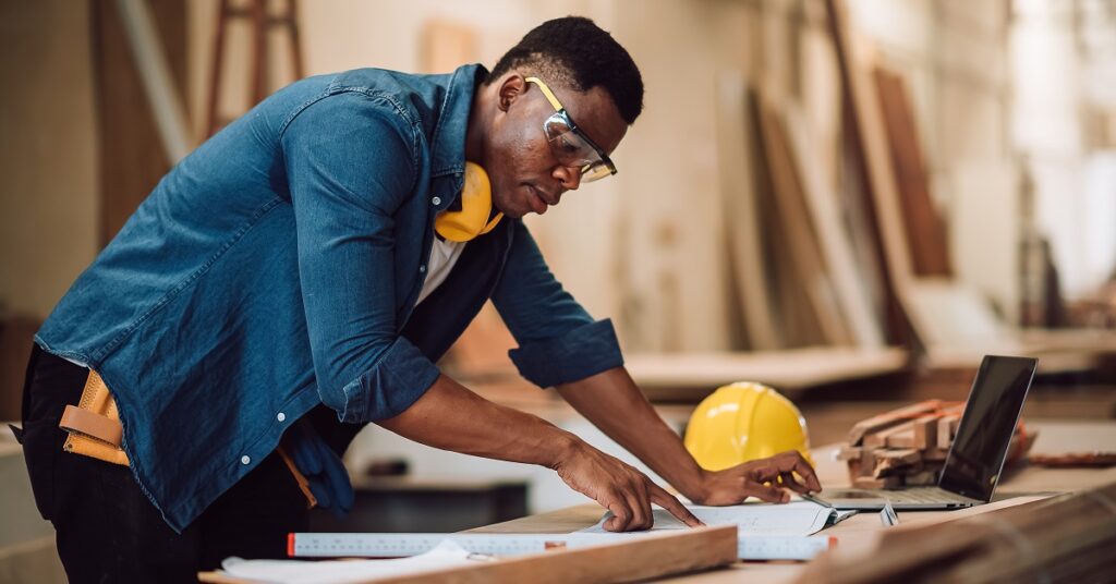 A small business owner researching contractor insurance
