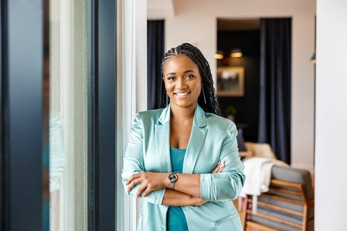 Stephanie Smith smiling in a light blue blazer