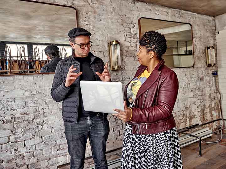 Angela McCrae speaking with a client