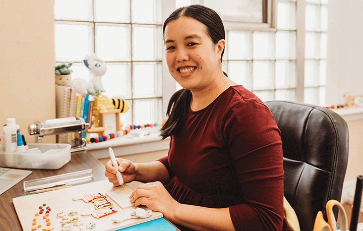 small business owner Kathy Austin working at her desk