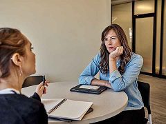 Sarah Murray sitting down with a tax advisor