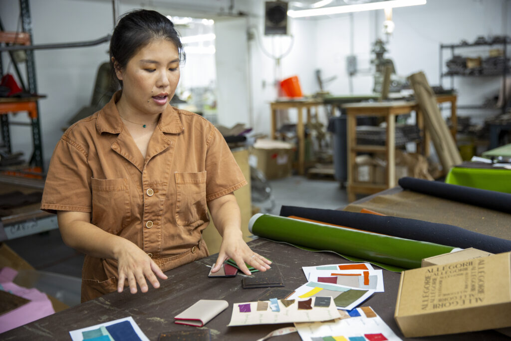 Heather Jiang reviews new product designs in the production factory