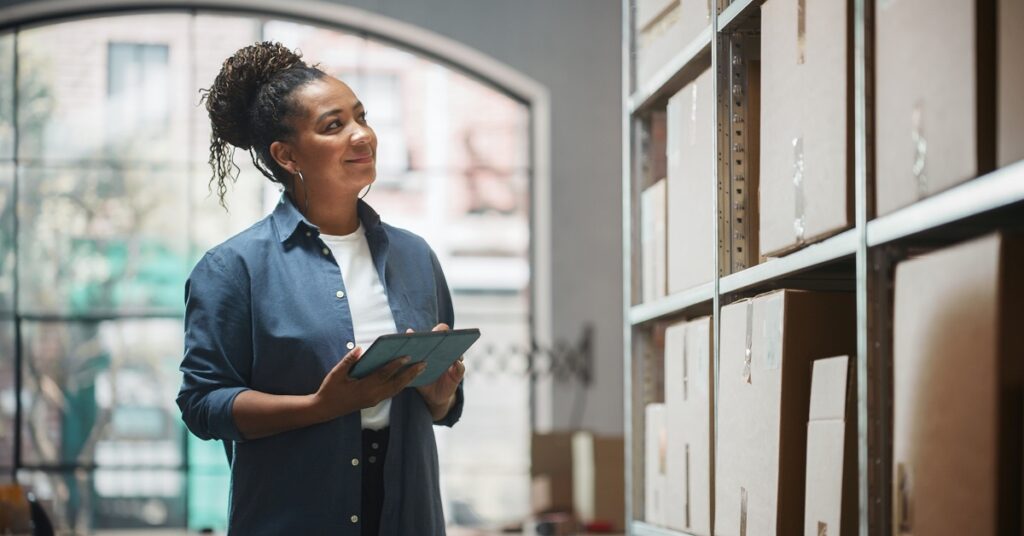 wholesale business owner looking at inventory for retailer