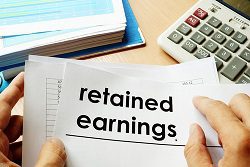 image of the word "retained earnings" with hands