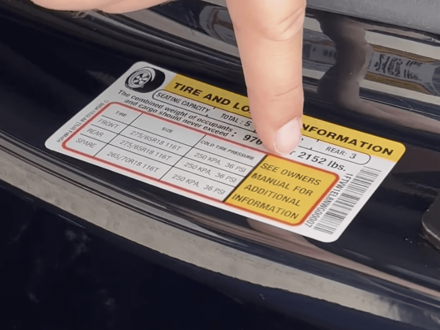 A GVWR rating sticker on the inside of a drivers door.